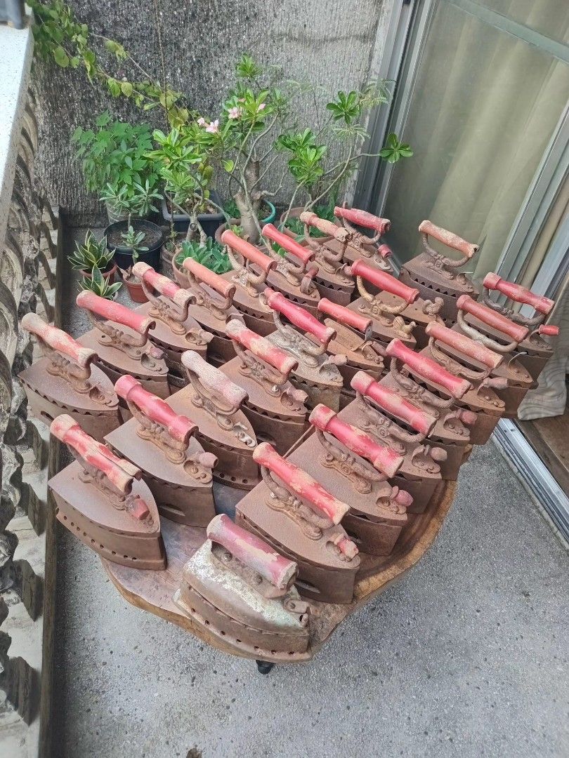 Vintage Philippine charcoal flat irons, "plantsa de uling" (Category: Irons & Steamers) located in San Fernando. Submitted by josephtanjuaquio (Listing ID 1437793712, Image 3). Description: Vintage Philippine charcoal flat irons, "plantsa de uling" Usage: These irons were heated by filling the hollow cast-iron body with hot charcoal. Design: They typically feature a cast-iron body with vent holes along the sides and a wooden handle for insulation
