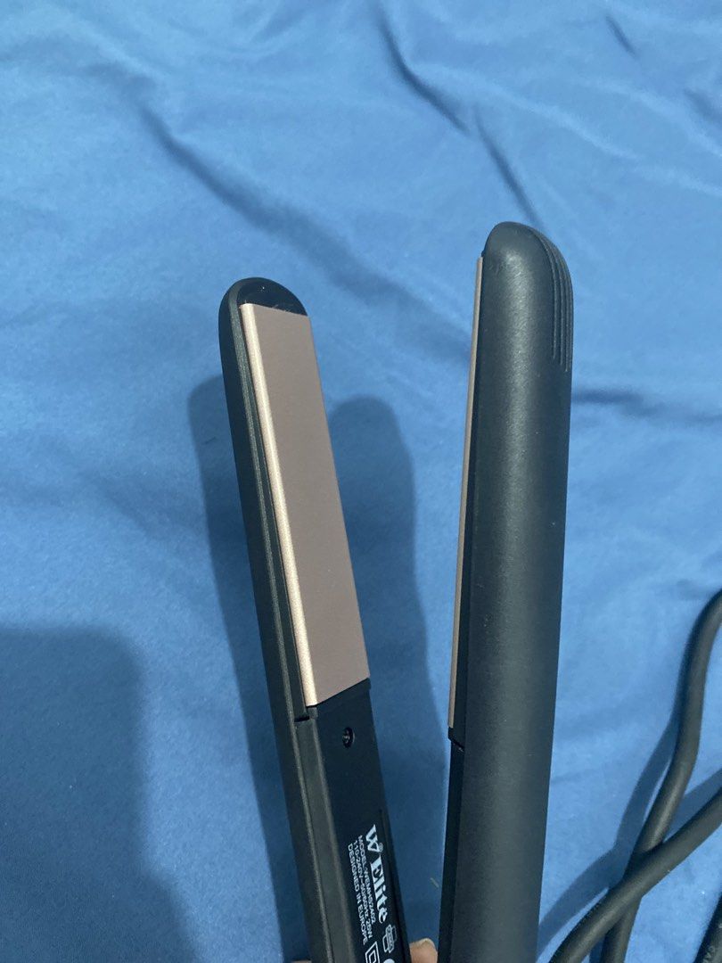 W Elite Hair Straightener (Category: Hair) located in Manila. Submitted by ceej0915 (Listing ID 1437787654, Image 3). Description: - W Elite hair straightener - Sleek black design with rosegold plates - Model: WEHS-24403 - Power: 110-240V, 25W - Black cord with velcro strap - Designed in Asia no box but good as new. 100% original.