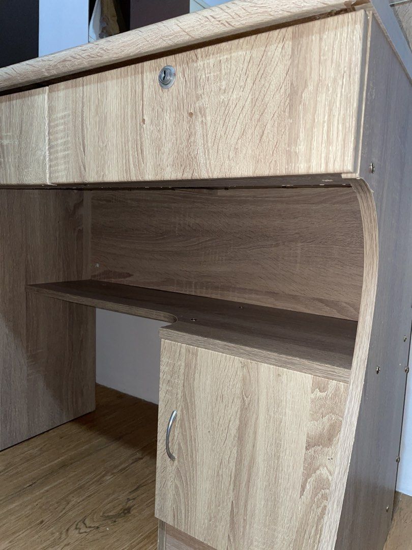 Wooden Vanity Table with Mirror (Category: Tables & Sets) located in Manila. Submitted by newbird-5396 (Listing ID 1437923978, Image 2). Description: - Wooden vanity table - Includes a mirror - Features two drawers - Has a cabinet for storage - Includes two small side shelves Dents: - No keys - No right handle (Drawer) - Bakbak pintura (only from the picture).