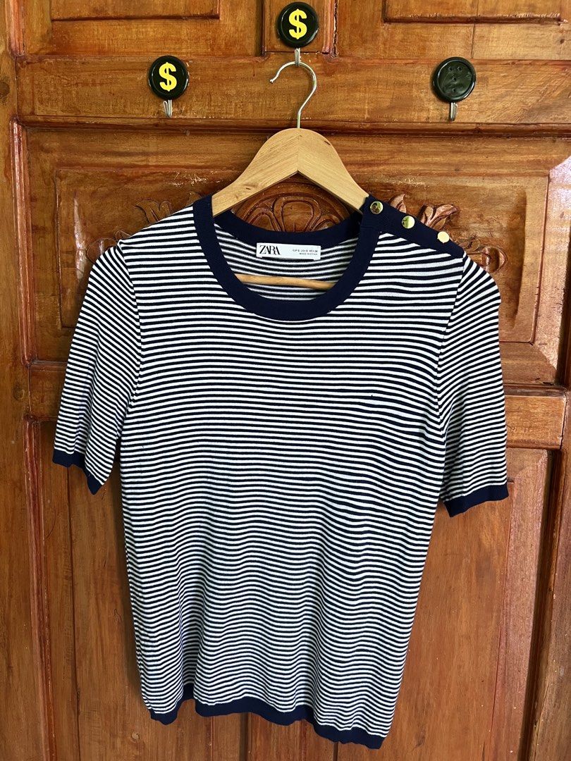 Zara Striped Top with Gold Buttons (Category: Blouses) located in San Fernando. Submitted by prettyfinds2021 (Listing ID 1437769742, Image 1). Description: - Zara striped top - Navy blue trim and gold button shoulder details - Round neckline, short sleeves - Size S - Made in China.