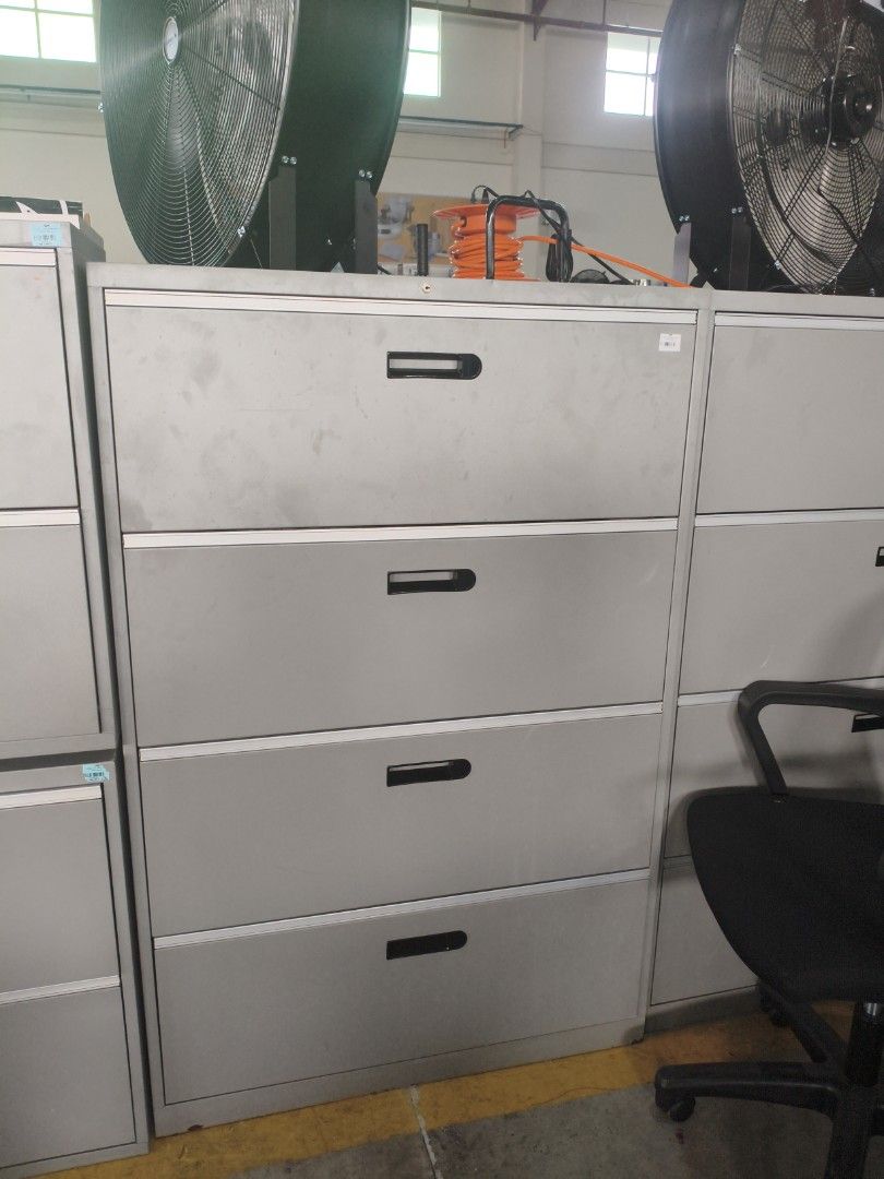 4-Drawer Metal Filing Cabinet (Category: Office Furniture & Fixtures) located in Manila. Submitted by hmrgrace5. (Listing ID 1438003820, Image 1). Description: - 4-drawer metal filing cabinet - Light gray finish - Black drawer handles - Spacious drawers for document storage - Perfect for office or home use.