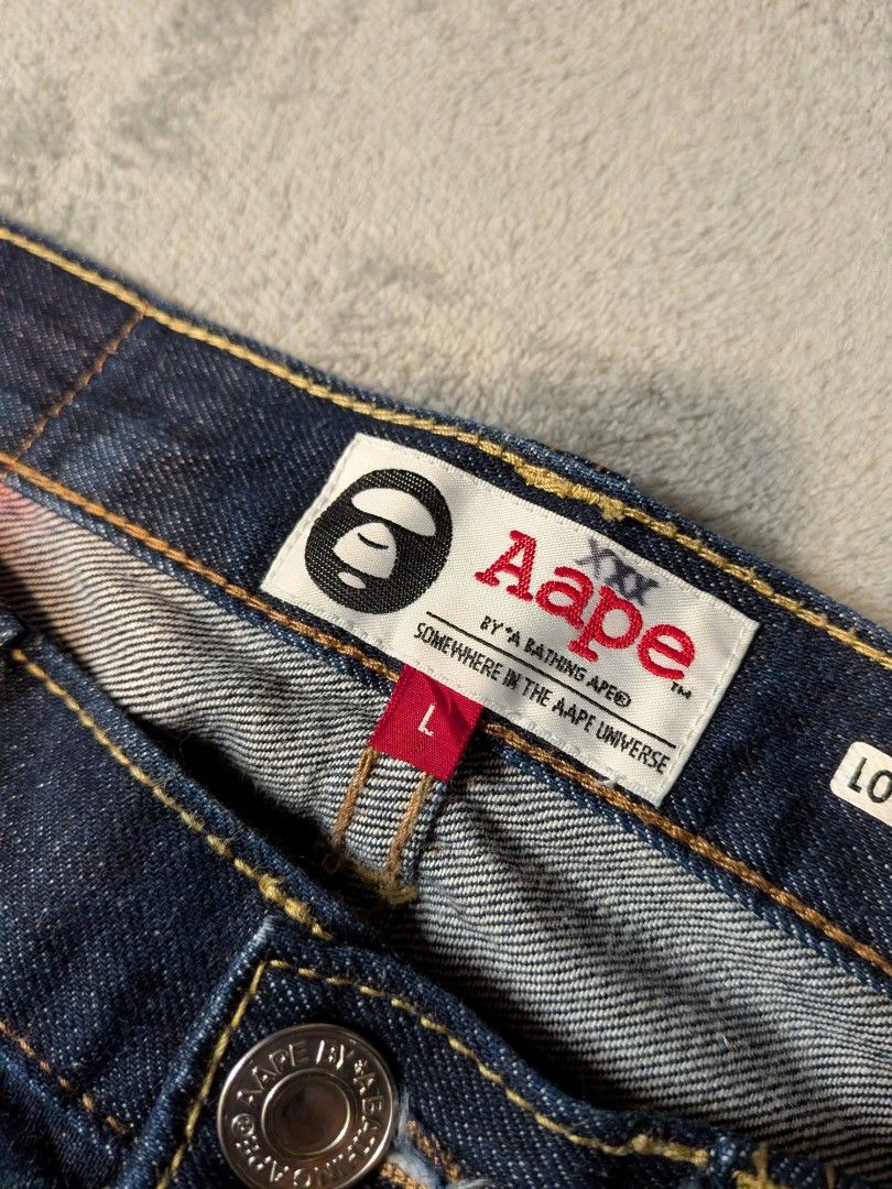 Aape by A Bathing Ape Loose Fit Jeans (Category: Jeans) located in Paniqui. Submitted by fndrs.kprs.ph (Listing ID 1437962164, Image 3). Description: Aape Denim Pants Size on tag: 34x31 Waistline: 34 Rise: 11.5 Thigh: 12 Inseam: 29 Hem: 8 Good as new No flaws.