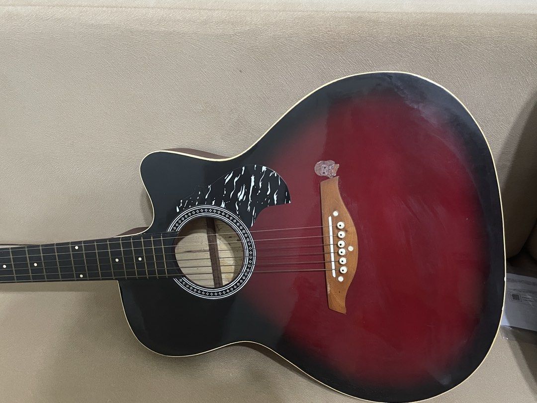 Acoustic Guitar with Case (Category: Musical Instruments) located in Abucay. Submitted by az.sells (Listing ID 1438040773, Image 2). Description: - Roxwood acoustic guitar - Black and red finish - Includes a black carrying case - Cutaway design - Parlor guitar size - Negotiable.