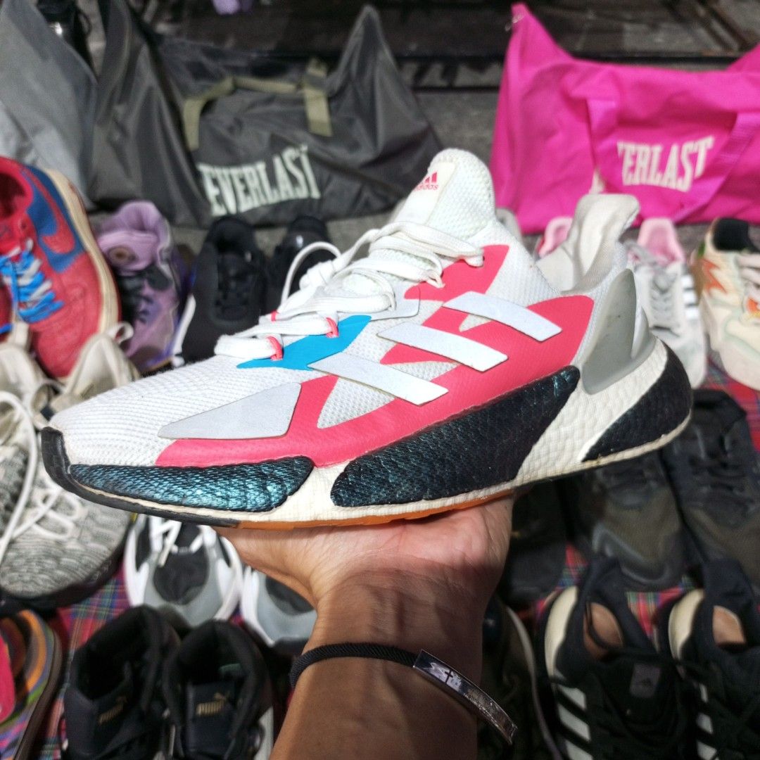 Adidas X9000L4 Running Shoes (Category: Sneakers) located in Naga. Submitted by silverearth.40de31 (Listing ID 1438109396, Image 1). Description: - Adidas X9000L4 running shoes - White upper with pink and blue accents - Black and teal sole design - Adidas logo visible.