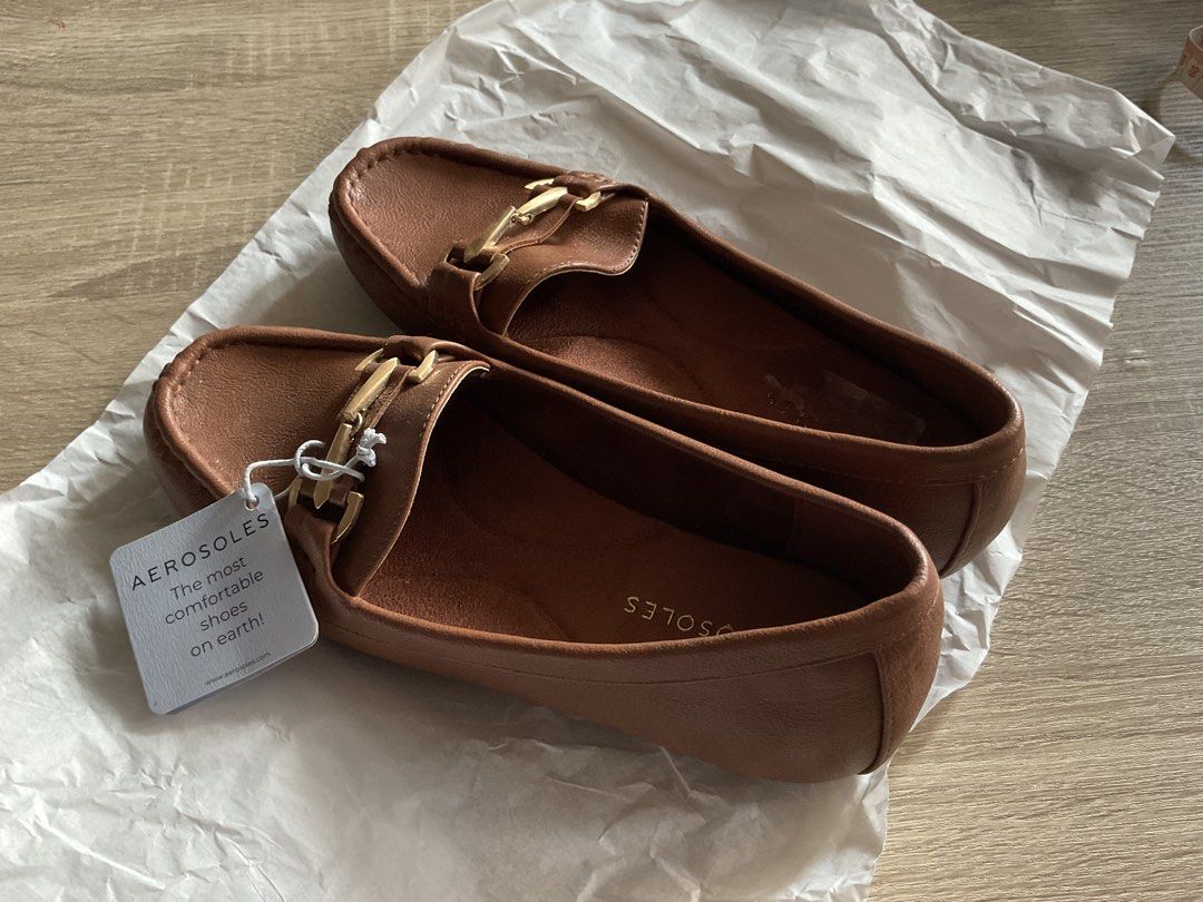 Aerosoles Brown Loafers Size 7 (Category: Loafers) located in Cainta. Submitted by thingsfromerika (Listing ID 1438110896, Image 3). Description: Aerosoles loafers in brown. Features a gold-tone buckle detail. The shoes are size 7. The soles have a textured design for grip. The shoes are unworn, with the original tag still attached. The shoes are made of a smooth material, leather..
