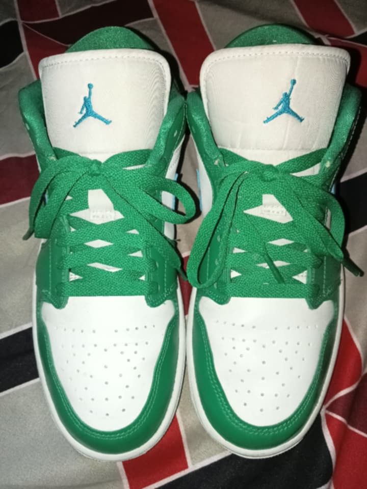 Air Jordan 1 Low Green White (Category: Sneakers) located in Magalang. Submitted by zeiansoria64090 (Listing ID 1437976028, Image 1). Description: - Air Jordan 1 Low sneakers - Color: Green and white - Blue swoosh - Blue Jumpman logo on the tongue - Air Jordan wings logo on the heel - Green laces - White sole.