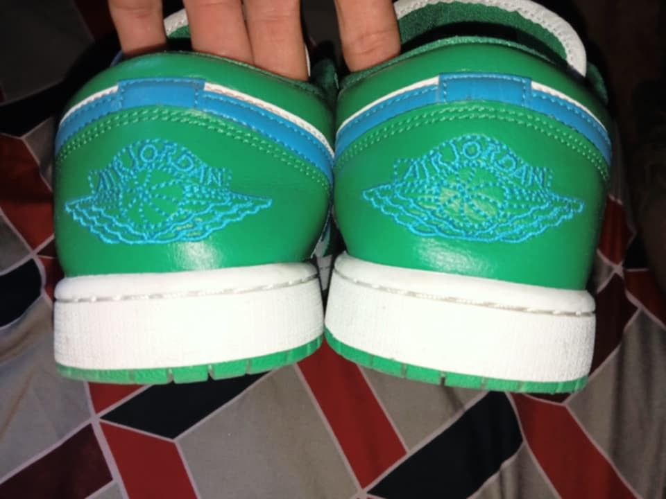 Air Jordan 1 Low Green White (Category: Sneakers) located in Magalang. Submitted by zeiansoria64090 (Listing ID 1437976028, Image 3). Description: - Air Jordan 1 Low sneakers - Color: Green and white - Blue swoosh - Blue Jumpman logo on the tongue - Air Jordan wings logo on the heel - Green laces - White sole.
