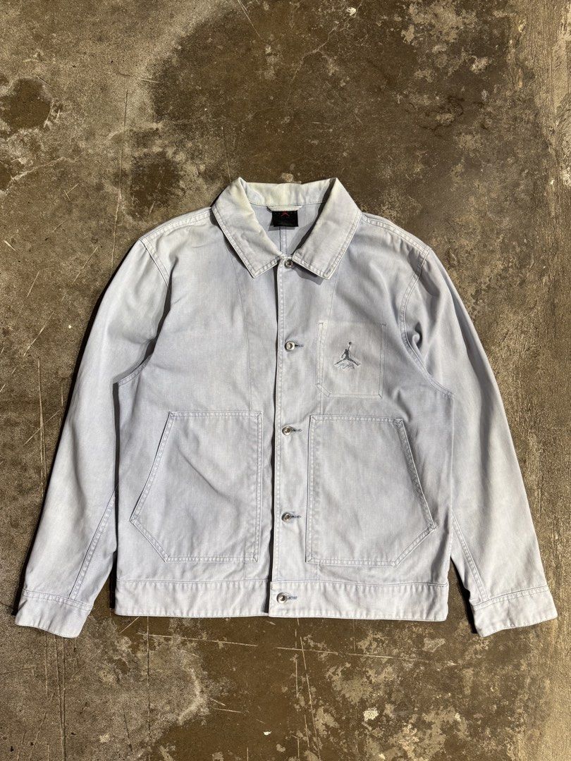 Air Jordan Essential Chicago Workwear Blue Jacket (Category: Coats, Jackets and Outerwear) located in Cavite. Submitted by dracokidstuff (Listing ID 1438039717, Image 1). Description: Air Jordan Essential Chicago Workwear Blue Jacket Size: Large Dimes: W22.5 L27 SL25 Very good condition Issue slight yellowish stain on collar - Light blue Jordan jacket - Size: L - Button closure - Features Jordan logo on chest - Two front pockets - Collar and butt