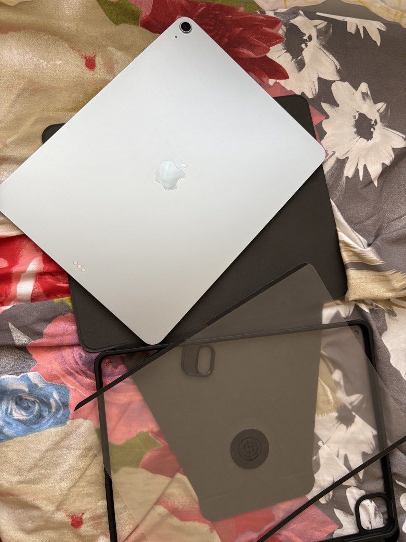 Apple iPad Air 13-inch (M3) (Category: iPad) located in Iloilo. Submitted by angelenepe01084 (Listing ID 1437939782, Image 1). Description: IPad Air 13-inch (M3) with 128GB storage. The device is blue. Includes a case. The screen displays the time and date. The iPad is running iPadOS version 26.4.1. With tempered glass installed and free 2 cases. Complete set box. No issue. Rfs: upgrade storage.
