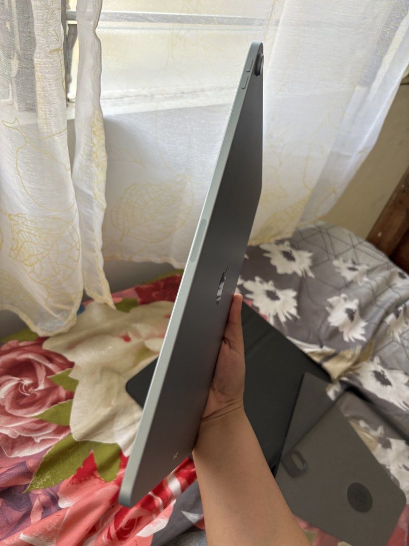 Apple iPad Air 13-inch (M3) (Category: iPad) located in Iloilo. Submitted by angelenepe01084 (Listing ID 1437939782, Image 3). Description: IPad Air 13-inch (M3) with 128GB storage. The device is blue. Includes a case. The screen displays the time and date. The iPad is running iPadOS version 26.4.1. With tempered glass installed and free 2 cases. Complete set box. No issue. Rfs: upgrade storage.