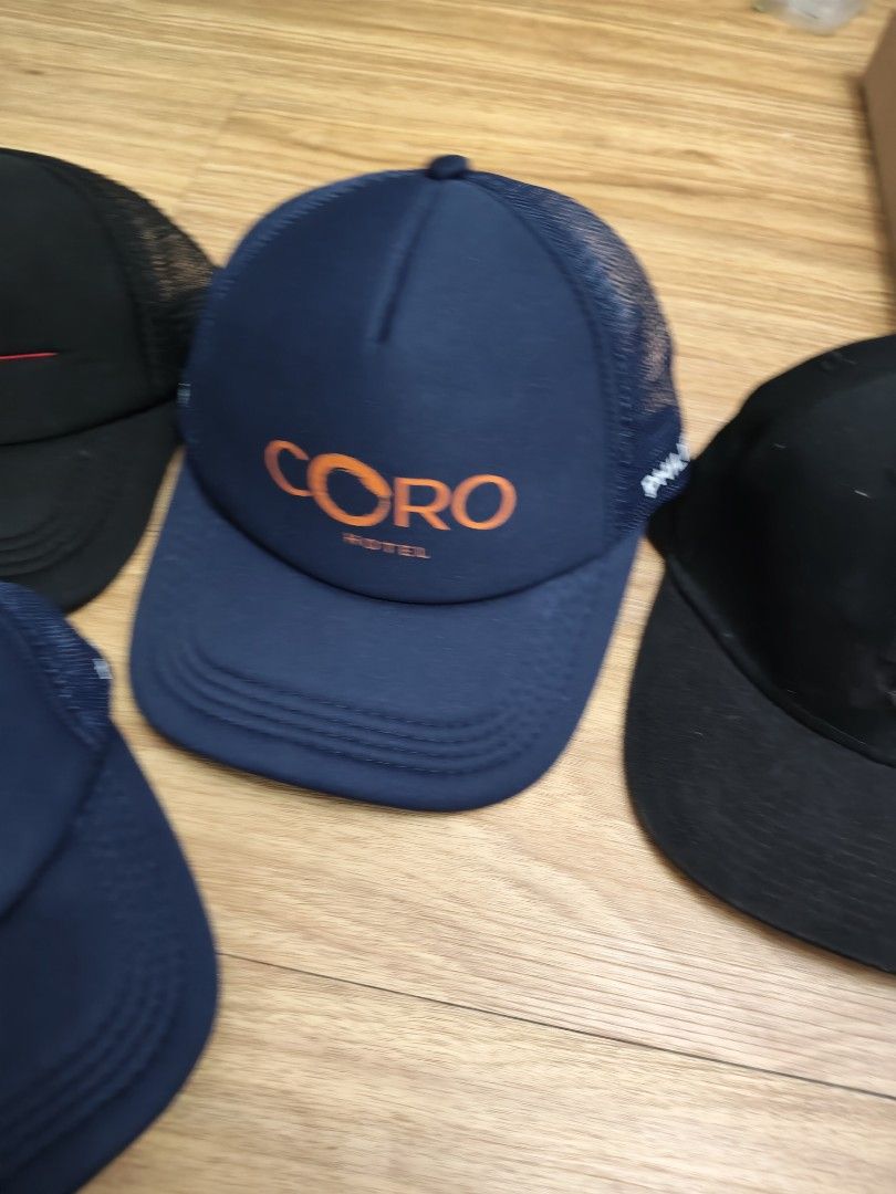 Assorted Caps (Category: Caps & Hats) located in Mandaluyong City. Submitted by derekalava (Listing ID 1438106220, Image 3). Description: - Assorted caps in various colors and designs. - Features caps with "Tropas" and "CORO HOTEL" logos. - Includes a black cap with a Puma tag. - Made from different materials (mesh, solid fabric). - Perfect for casual wear and adding style. get all if interested please call txt or pm me see pics for the condition