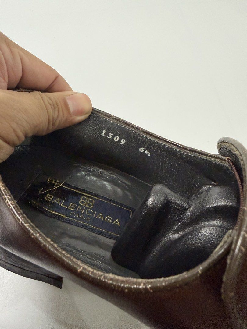Balenciaga Brown Leather Loafers (Category: Loafers) located in Alfonso. Submitted by jbcamet (Listing ID 1438064861, Image 3). Description: - Balenciaga loafers - Brown leather - Size: 6.5 - Slip-on design - Decorative strap with Balenciaga logo - Textured leather upper - Leather lining - Made in Italy - Soles show wear.
