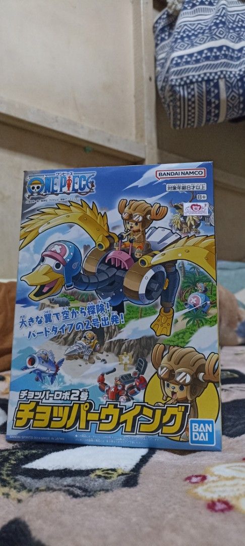 Bandai One Piece Chopper Wing Figure (Category: Figurines & Statues) located in Rizal. Submitted by onepiece.com (Listing ID 1438079852, Image 1). Description: - Bandai One Piece Chopper Wing figure. - Features Chopper riding a mechanical duck. - Back in Box, in original packaging. - A must-have collectible for One Piece fans. - Box shows the figure's design..