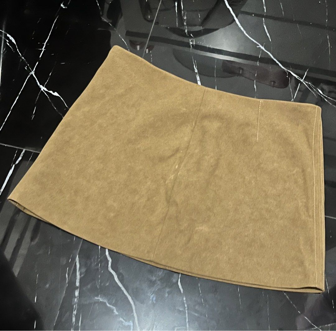 BERSHKA Brown Suede Skirt (Category: Skirts) located in Manila. Submitted by althearvr (Listing ID 1438030077, Image 1). Description: The skirt has minimal flaws at the front which can be seen on the pictures, other than that there are no other flaws. DM of interested!!!.