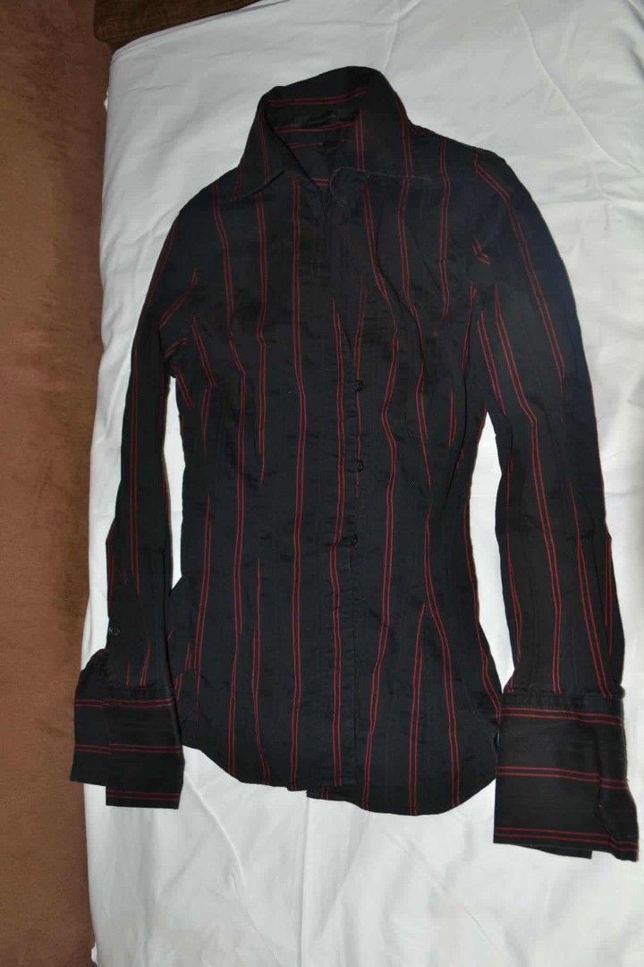Black Striped Long Sleeve Shirt (Category: Longsleeves) located in Bulacan. Submitted by atticus26 (Listing ID 1437958556, Image 1). Description: - Black long-sleeved shirt - Red vertical stripes - Collared neckline - Button-down closure - Flared cuffs - Tailored fit - Slight sheen fabric.