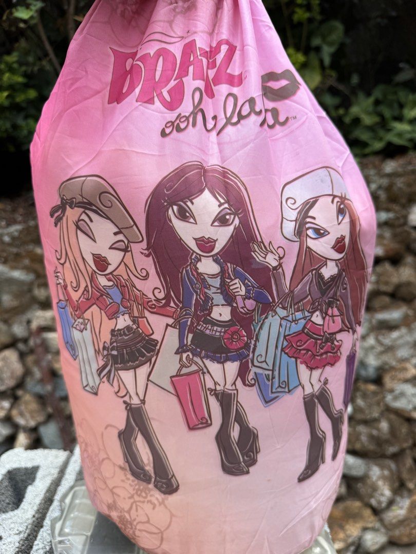 Bratz Ooh La La Sleeping Bag (Category: Kids Toys) located in Baguio. Submitted by goodfindsbaguio (Listing ID 1437960842, Image 2). Description: - Bratz sleeping bag - Pink design with Bratz characters - Zipper closure - Includes Bratz logo tag - Pink exterior, lighter pink interior - Features "Bratz Ooh La La" design.