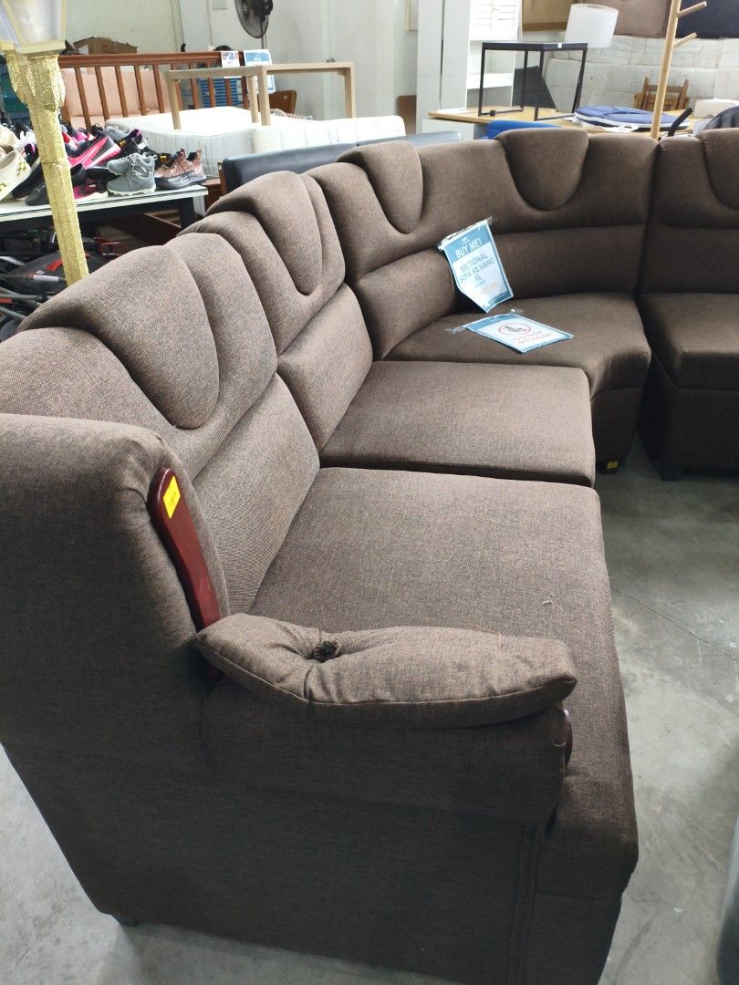 Brown Sectional Sofa (Category: Sofas) located in Manila. Submitted by hmrgrace5. (Listing ID 1437969878, Image 1). Description: - Spacious brown sectional sofa - Curved design - Multiple seating sections - Textured fabric - Padded armrests - Ideal for living rooms and lounge areas.