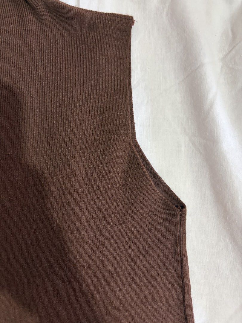 Brown Sleeveless Turtleneck Vest (Category: Sleeveless) located in Manila. Submitted by andreacap (Listing ID 1437966034, Image 3). Description: - Brown sleeveless vest - Turtleneck design - Ribbed knit fabric - Simple, classic style - Perfect for layering - Versatile: dress up or down - Solid brown color 🎀 currently decluttering/selling pre-loved clothes, check my page for more details! 🎀 please manage expectations, you may send me a dm for mo