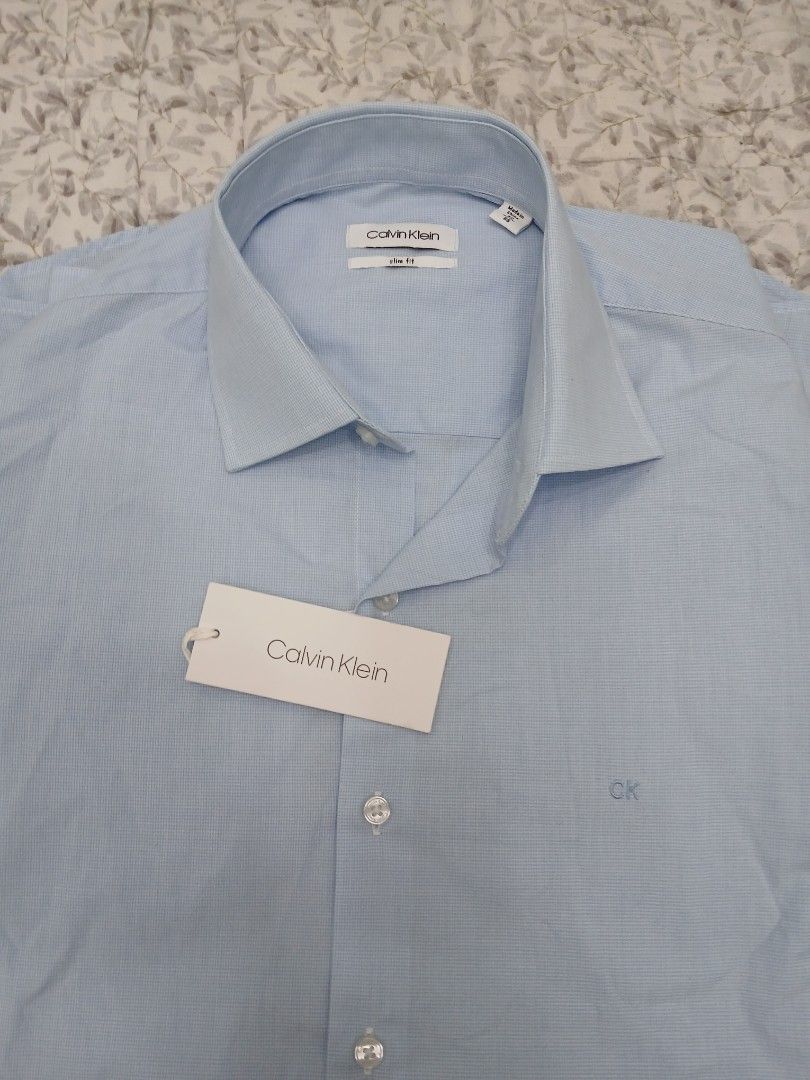 CALVIN KLEIN SLIM FIT LONG SLEEVE (Category: Tshirts & Polo Shirts ) located in Mabalacat. Submitted by michelle.m.d. (Listing ID 1438048770, Image 1). Description: Branded, brand new Size 40/86 Length 28 Chest 20.