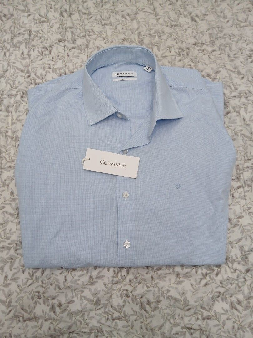 CALVIN KLEIN SLIM FIT LONG SLEEVE (Category: Tshirts & Polo Shirts ) located in Mabalacat. Submitted by michelle.m.d. (Listing ID 1438048770, Image 2). Description: Branded, brand new Size 40/86 Length 28 Chest 20.