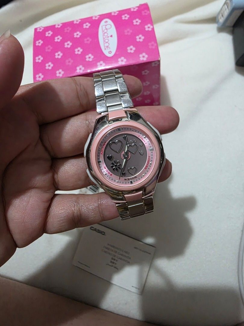 Casio Baby-G Pink Watch POPTONE (Category: Women's Watches) located in Bocaue. Submitted by wendy.plew (Listing ID 1438079203, Image 3). Description: - Casio Baby-G watch POPTONE - Pink and silver design - Includes: Original box, warranty card, and tag - Stainless steel band - Pink dial with heart and flower details -I beleive this watch is discountinued and is sought after some is looking through a bidding or auction sites . -Model: LCF-10D-4A (