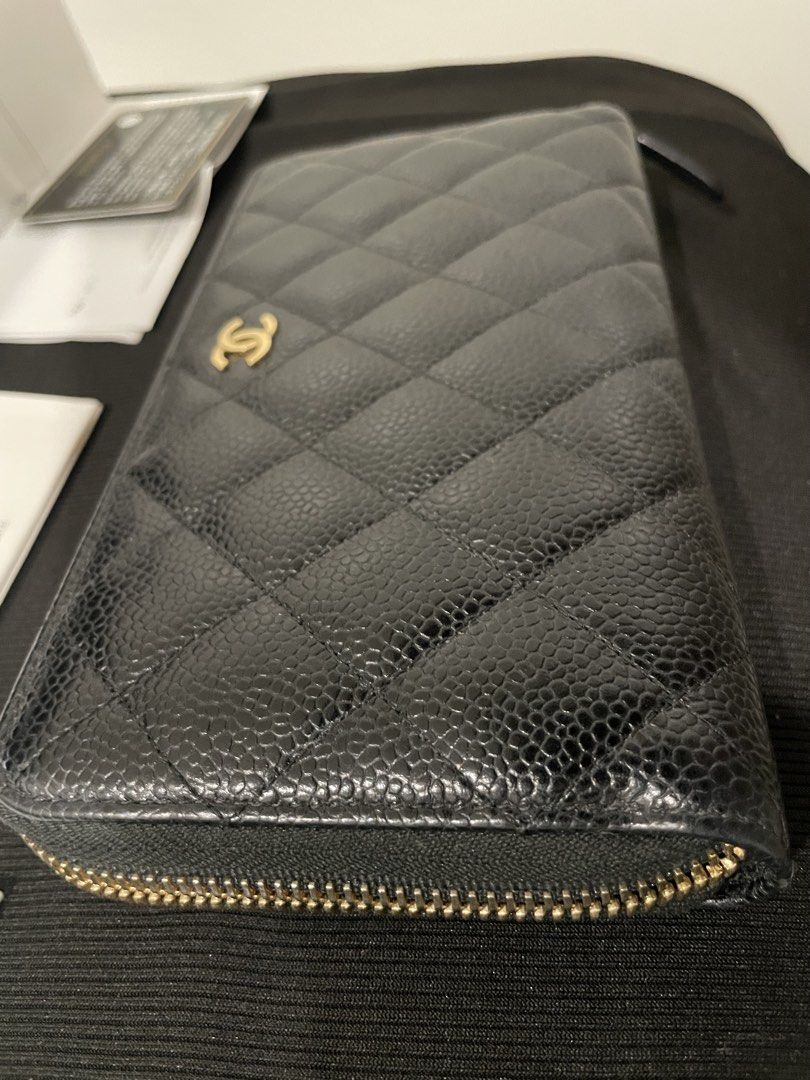 Chanel Caviar Leather Zip Around Wallet (Category: Luxury Bags & Wallets) located in Manila. Submitted by luxury889 (Listing ID 1438080854, Image 3). Description: - Authentic Chanel wallet - Black caviar leather - Iconic CC logo - Gold-tone zipper - Includes: original box, authenticity card, care booklet.