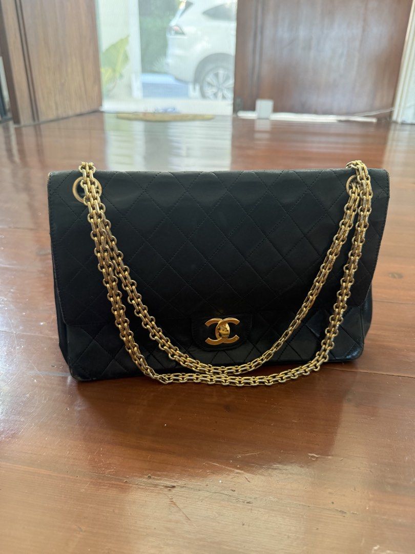 Chanel Vintage Lambskin Shoulder Bag (Category: Luxury Bags & Wallets) located in Cebu City. Submitted by siennakats (Listing ID 1437954094, Image 1). Description: - Authentic Chanel shoulder bag - Color: Black - Hardware: Gold-tone - Design: Quilted - Strap: Chain - Closure: Flap with CC turn-lock - Interior: Zippered pocket - Condition: Shows wear on corners and edges.