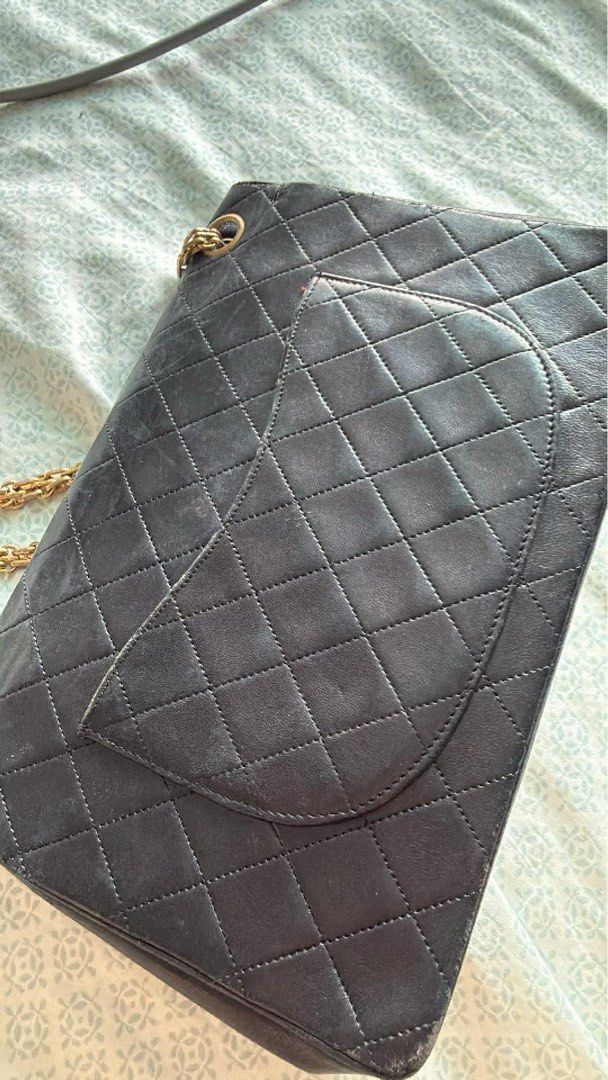 Chanel Vintage Lambskin Shoulder Bag (Category: Luxury Bags & Wallets) located in Cebu City. Submitted by siennakats (Listing ID 1437954094, Image 2). Description: - Authentic Chanel shoulder bag - Color: Black - Hardware: Gold-tone - Design: Quilted - Strap: Chain - Closure: Flap with CC turn-lock - Interior: Zippered pocket - Condition: Shows wear on corners and edges.