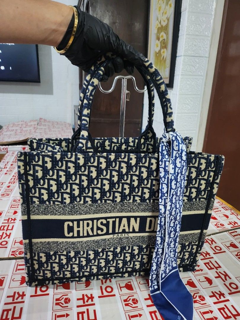 Christian Dior Book Tote bag (Category: Luxury Bags & Wallets) located in Caloocan City. Submitted by xtrabaggageforsale (Listing ID 1437948056, Image 1). Description: SALE!!!!!! In excellent preloved condition from Korea. Measurement 14'H x 11'L x 6'W Material: Crafted from durable canvas embroidery with premium textile craftsmanship Pattern: Signature Dior Oblique motif fully embroidered across the exterior. -See photos and item specifics for d