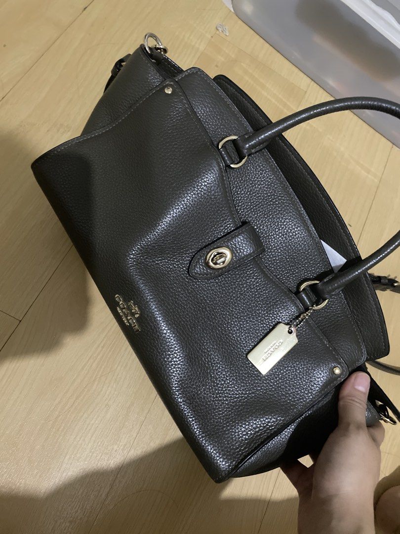 Coach Shoulder Bag (Category: Luxury Bags & Wallets) located in Manila. Submitted by mars1122334455 (Listing ID 1438066535, Image 1). Description: - self authenticate - this is used so pls manage expectations -Coach shoulder bag in dark green - Top handle and detachable shoulder strap - Includes gold-tone Coach tag - Flap closure with turn lock - Made of textured leather - Suitable for everyday use and special events.