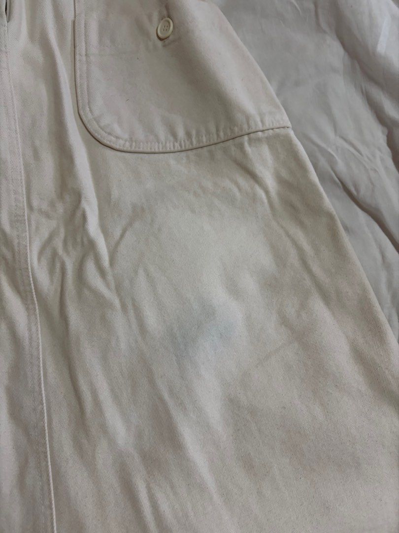 Cream-colored Skirt with Pockets (Category: Skirts) located in Manila. Submitted by andreacap (Listing ID 1437969943, Image 2). Description: - Cream-colored skirt - Two front pockets - Button details - Elastic waistband - Back slit - Zipper closure - Condition: Visible stain on front 🎀 currently decluttering/selling pre-loved clothes, check my page for more details! 🎀 please manage expectations, you may send me a dm for more photos 🎀 my tops a