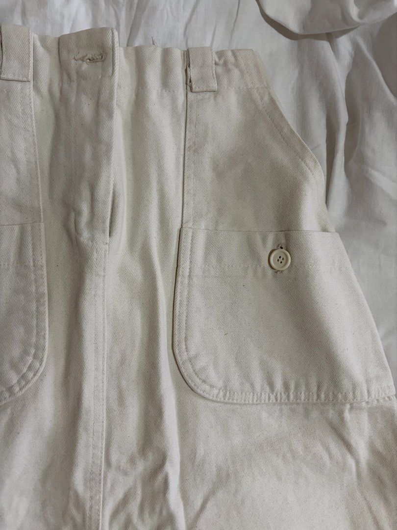 Cream-colored Skirt with Pockets (Category: Skirts) located in Manila. Submitted by andreacap (Listing ID 1437969943, Image 3). Description: - Cream-colored skirt - Two front pockets - Button details - Elastic waistband - Back slit - Zipper closure - Condition: Visible stain on front 🎀 currently decluttering/selling pre-loved clothes, check my page for more details! 🎀 please manage expectations, you may send me a dm for more photos 🎀 my tops a