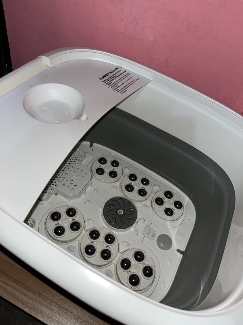 Daewoo Foot Spa Massager (Category: Massage Devices) located in Baguio. Submitted by ibarrajenn02122 (Listing ID 1438105257, Image 2). Description: Daewoo Foot Spa Massager - Foldable design for easy storage. Features massage rollers and a water reservoir. Includes cover. In good working condition. White and gray..
