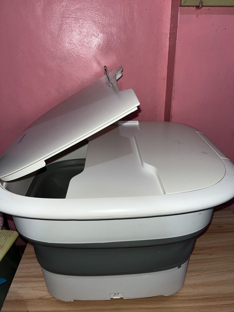 Daewoo Foot Spa Massager (Category: Massage Devices) located in Baguio. Submitted by ibarrajenn02122 (Listing ID 1438105257, Image 3). Description: Daewoo Foot Spa Massager - Foldable design for easy storage. Features massage rollers and a water reservoir. Includes cover. In good working condition. White and gray..