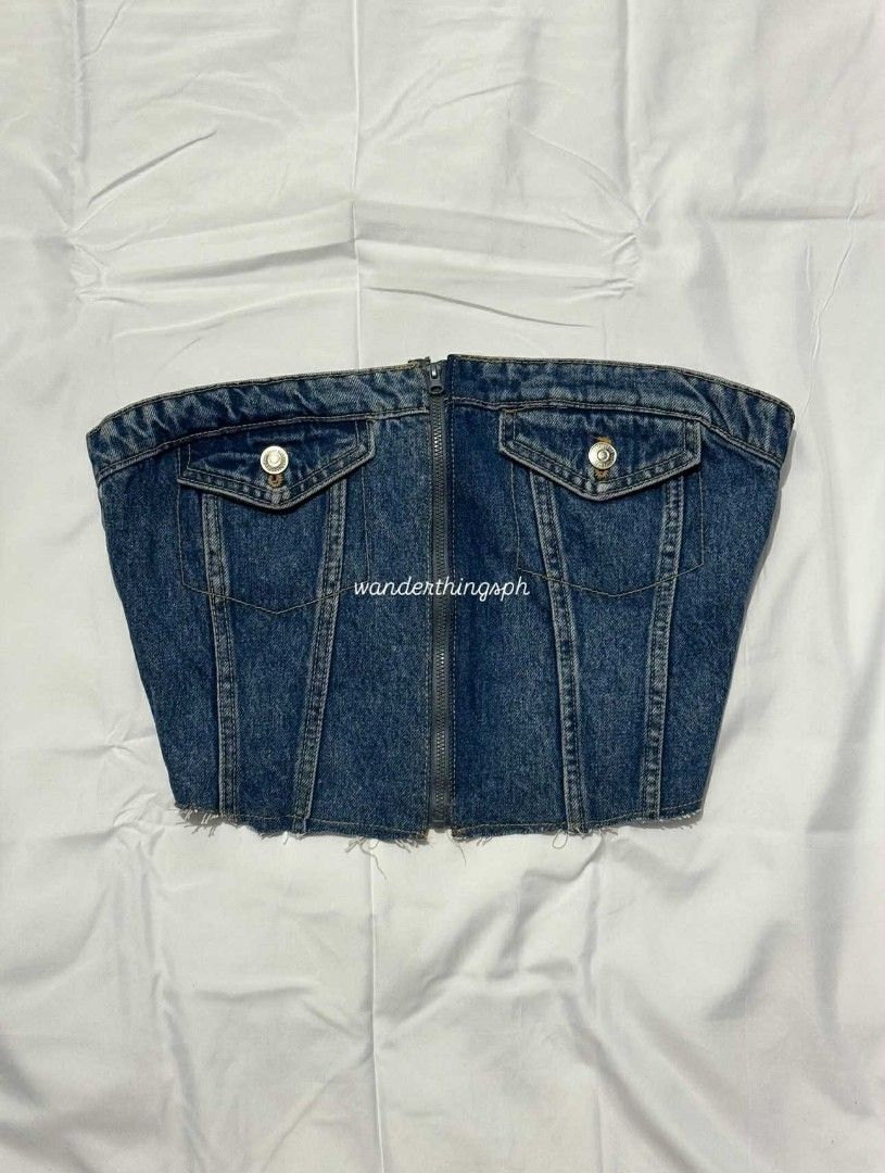 Denim Corset Top (Category: Sleeveless) located in Malabon City. Submitted by WanderThingsPH (Listing ID 1438082638, Image 3). Description: - Denim corset top - Front zipper closure - Two front pockets with button details - Shirred back panel for comfort - Raw hemline - Perfect for a casual and chic look.