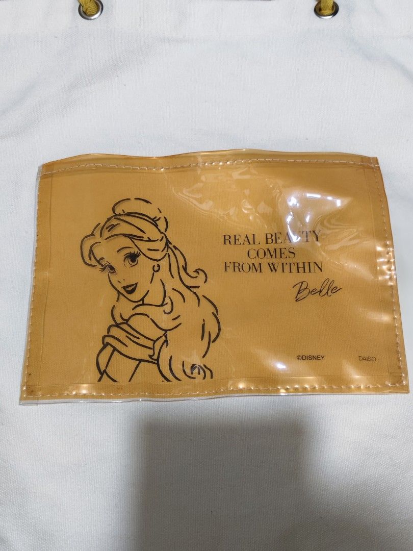 Disney Belle Tote Bag (Category: Tote Bags) located in Makati City. Submitted by abegailbrezuela (Listing ID 1437983220, Image 3). Description: - Disney's Beauty and the Beast themed tote bag. - Features Belle design. - White canvas body. - Yellow handles and pocket. - Pocket features Belle's image and the quote "Real Beauty Comes From Within." - Made of durable canvas material. - Ideal for carrying various items..