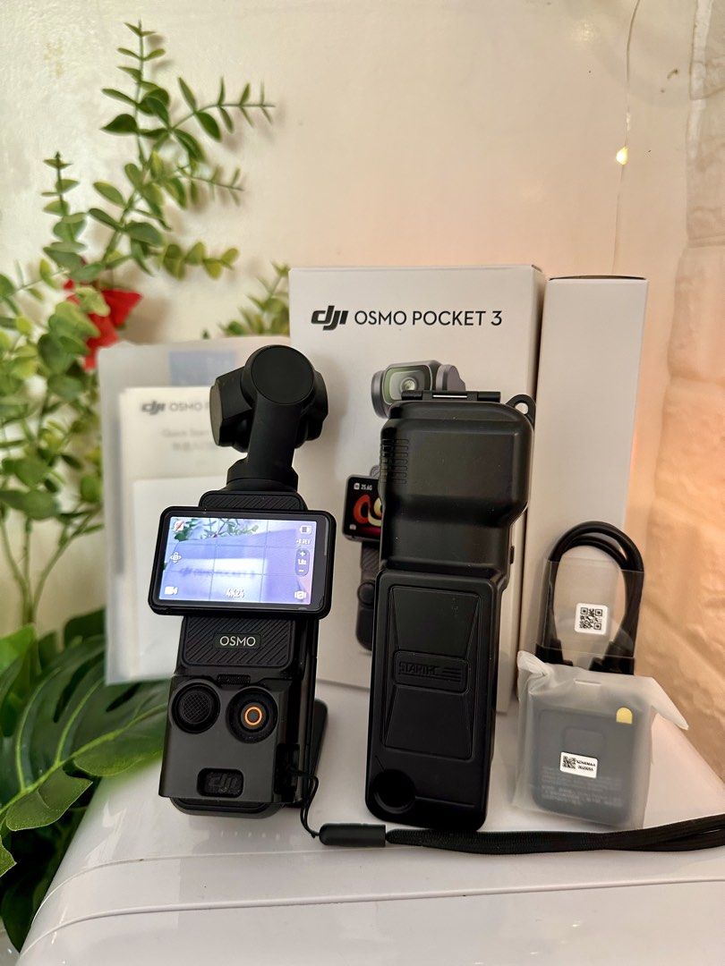 DJI Osmo Pocket 3 (Standard version) with complete accessories (Category: Cameras) located in Quezon City. Submitted by heymdc (Listing ID 1437989314, Image 2). Description: DJI Osmo Pocket 3 camera for sale 🌻 First owner. Well taken care of. Lady-owned. Has a screen protector since Day 1 and in pristine condition. No marks. COMPLETE ACCESSORIES. Comes with free: magnetic mount case, screen protector case, and freebies. Reason for sale: Upgradin