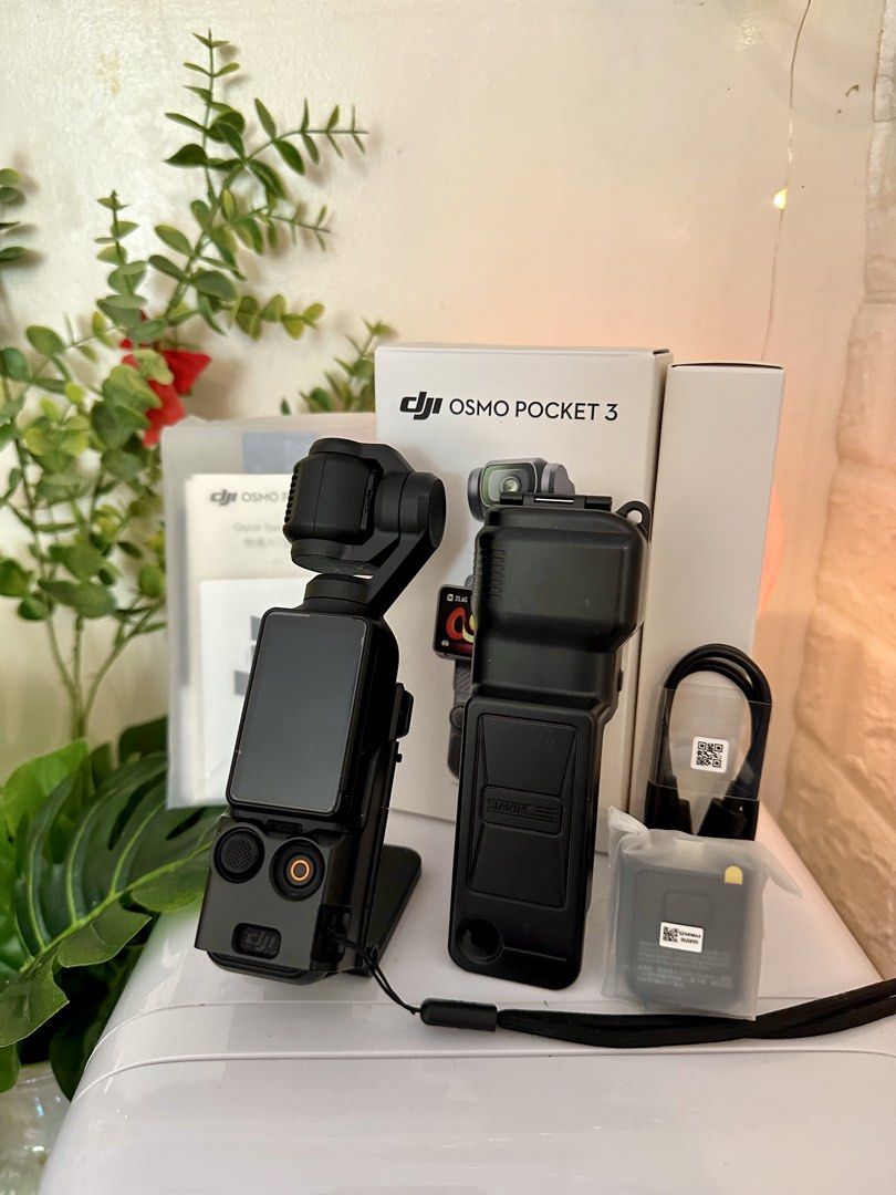 DJI Osmo Pocket 3 (Standard version) with complete accessories (Category: Cameras) located in Quezon City. Submitted by heymdc (Listing ID 1437989314, Image 1). Description: DJI Osmo Pocket 3 camera for sale 🌻 First owner. Well taken care of. Lady-owned. Has a screen protector since Day 1 and in pristine condition. No marks. COMPLETE ACCESSORIES. Comes with free: magnetic mount case, screen protector case, and freebies. Reason for sale: Upgradin