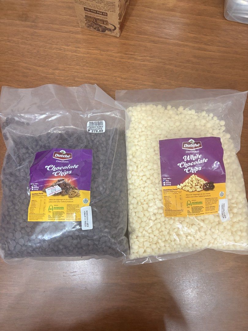 Dutche Chocolate Chips - Dark & White (Category: Packaged & Instant Food) located in Manila. Submitted by opheliatoys (Listing ID 1437986850, Image 2). Description: - Dutche Chocolate Chips available in Dark and White varieties. - Each bag is suitable for baking. - Market Price: ₱270 per bag. - Both Dark and White chocolate chips are available. - Bags are sealed..