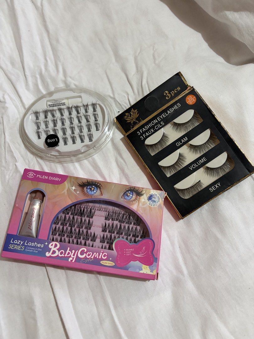 Eyelashes and Cluster Lashes Set (Category: Makeup) located in Manila. Submitted by andreacap (Listing ID 1437971380, Image 1). Description: - Styles include: - BabyComic (includes glue) - used the first line of the cluster but not for me - Tried also the first pair of eyelash set in black box but not for me - The cluster lashes in transparent box are never been used - Take all for 100 🎀 currently decluttering/selling pre-loved clothes, check my