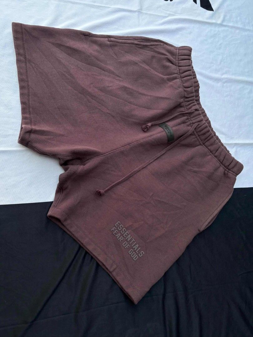 Fear of God Essentials Shorts (Category: Shorts) located in Cagayan de Oro. Submitted by aj_finds22 (Listing ID 1437993511, Image 3). Description: - Fear of God Essentials shorts 30x18 EXCELLENT CONDI,LIKE NEW NO ISSUE EMBOSSED LOGO, NO CRACK ON LOGO - Color: Brown - Size: L - Features the Essentials logo - Drawstring waistband - Includes pockets - Made with soft material.