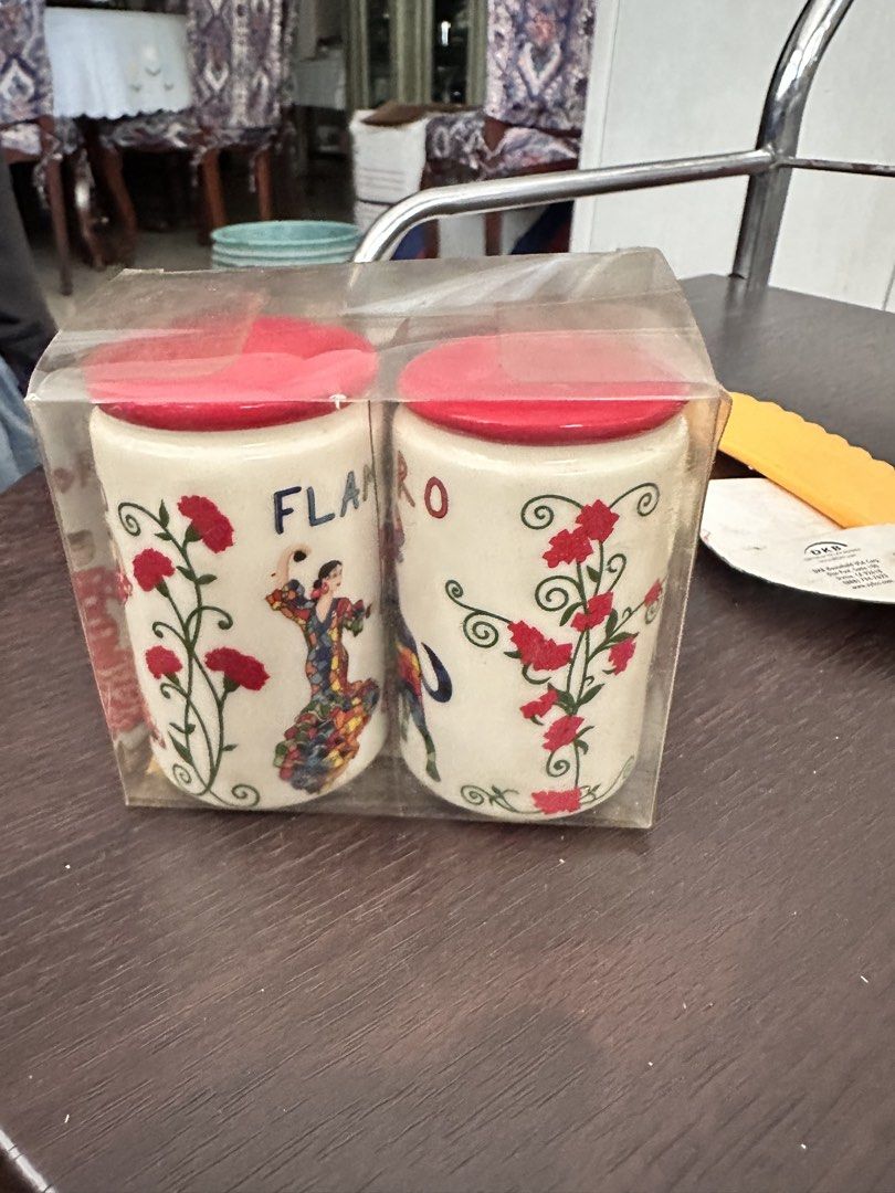 Flamenco Salt and Pepper Shakers Set (Category: Food Organization & Storage) located in Quezon City. Submitted by mystictiger.019d9c (Listing ID 1438107215, Image 1). Description: - Set of two ceramic salt and pepper shakers - Features red lids - Decorated with floral design and a flamenco dancer - Brand new, in original packaging - Perfect for adding a touch of Spanish flair to your dining table.