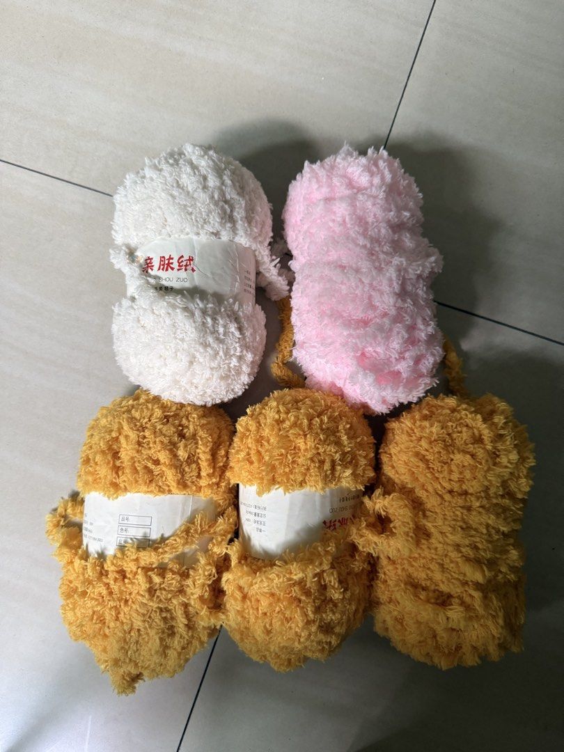 Fluffy Yarn - White, Pink, and Yellow (Category: Craft Supplies & Tools) located in Paranaque City. Submitted by emshop_sandy (Listing ID 1437955151, Image 1). Description: - Soft and fluffy yarn - Colors: White, pink, and yellow - New and unused - Ideal for knitting or crocheting - Perfect for creating textured items .
