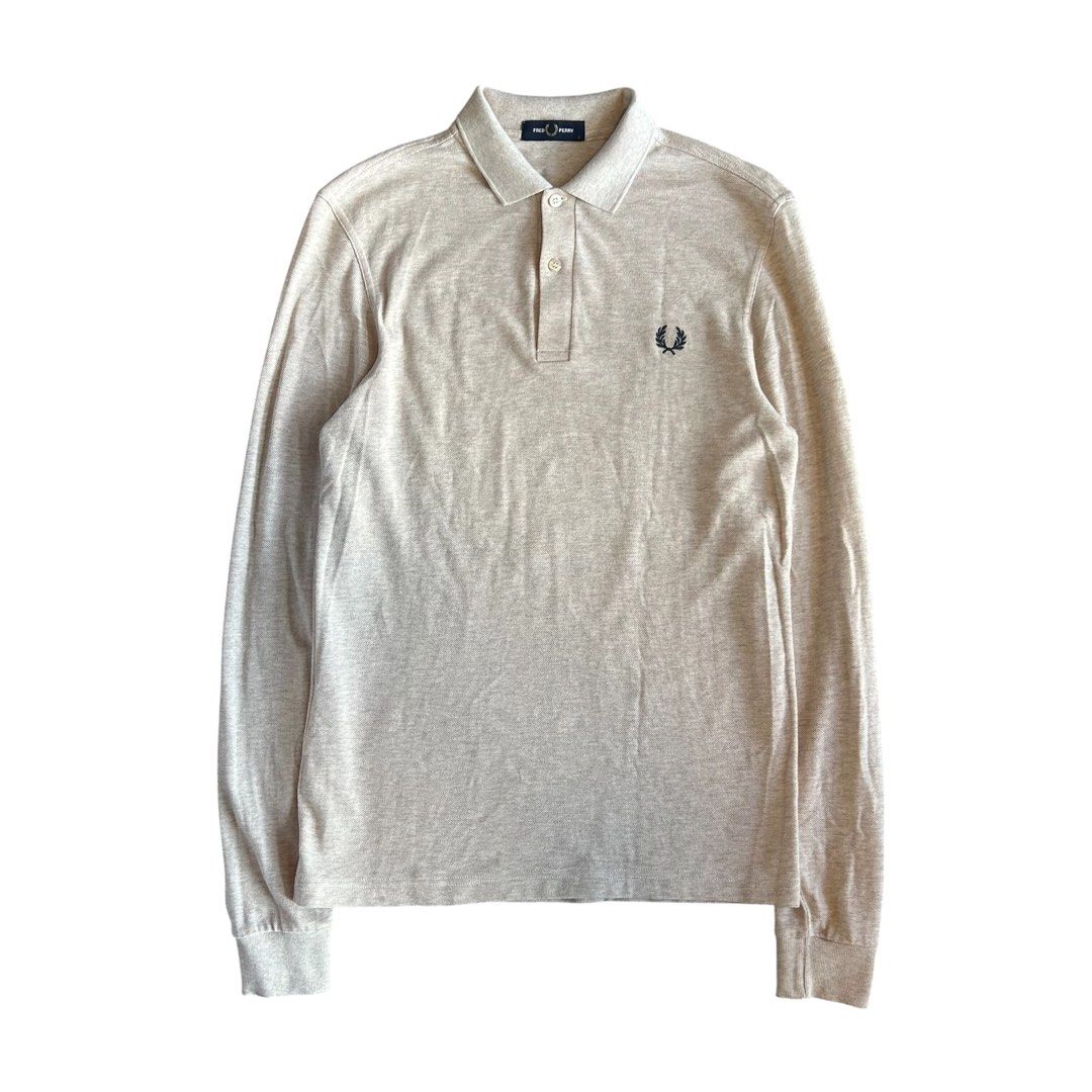 Fred Perry Long Sleeve Polo Shirt (Category: Tshirts & Polo Shirts ) located in Quezon. Submitted by webtothecloset (Listing ID 1437965972, Image 1). Description: - Fred Perry long sleeve polo shirt - Classic design - Collared neckline - Three-button placket - Solid color - Features the iconic Fred Perry laurel wreath logo - Brand new condition.