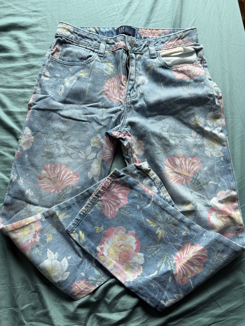 GAP Denim Floral Print Jeans (Category: Jeans) located in Pasig City. Submitted by peonyfield (Listing ID 1437987479, Image 1). Description: - GAP denim jeans - Floral print design - Regular girlfriend fit - Fits XS-S - Light blue wash - Button and zipper closure - Front and back pockets.