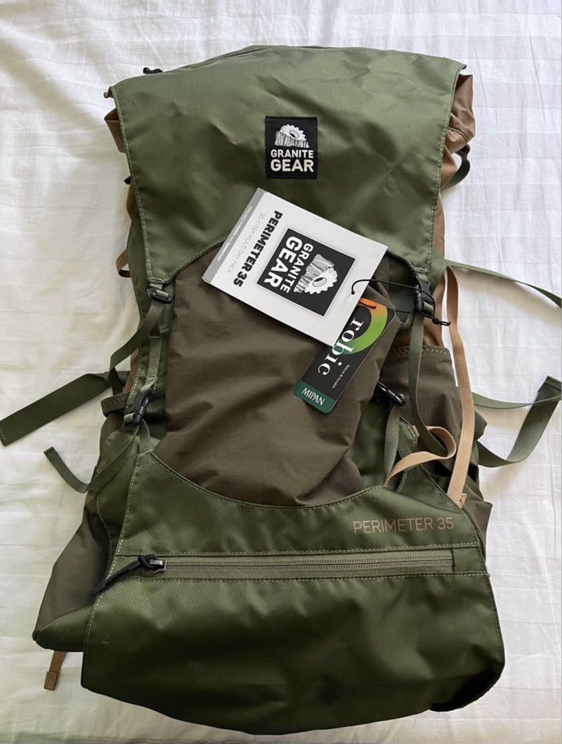 Granite Gear Perimeter 35 Backpack (Category: Backpacks) located in Taguig. Submitted by surefyr (Listing ID 1438111277, Image 1). Description: - Granite Gear Perimeter 35 Backpack - 35L capacity - Adjustable hip belt and torso length - Multiple straps and compartments - Green and brown color scheme - Includes original tag.