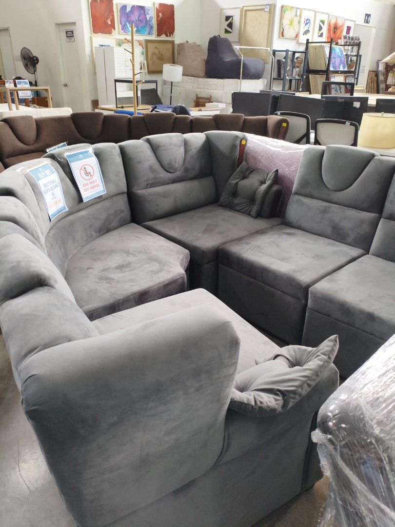 Gray Sectional Sofa (Category: Sofas) located in Manila. Submitted by hmrgrace5. (Listing ID 1437970051, Image 1). Description: - Stylish gray sectional sofa - Comfortable design with multiple sections - Soft, velvety texture - Modern aesthetic - Includes a matching pillow - Perfect for living rooms and lounges.
