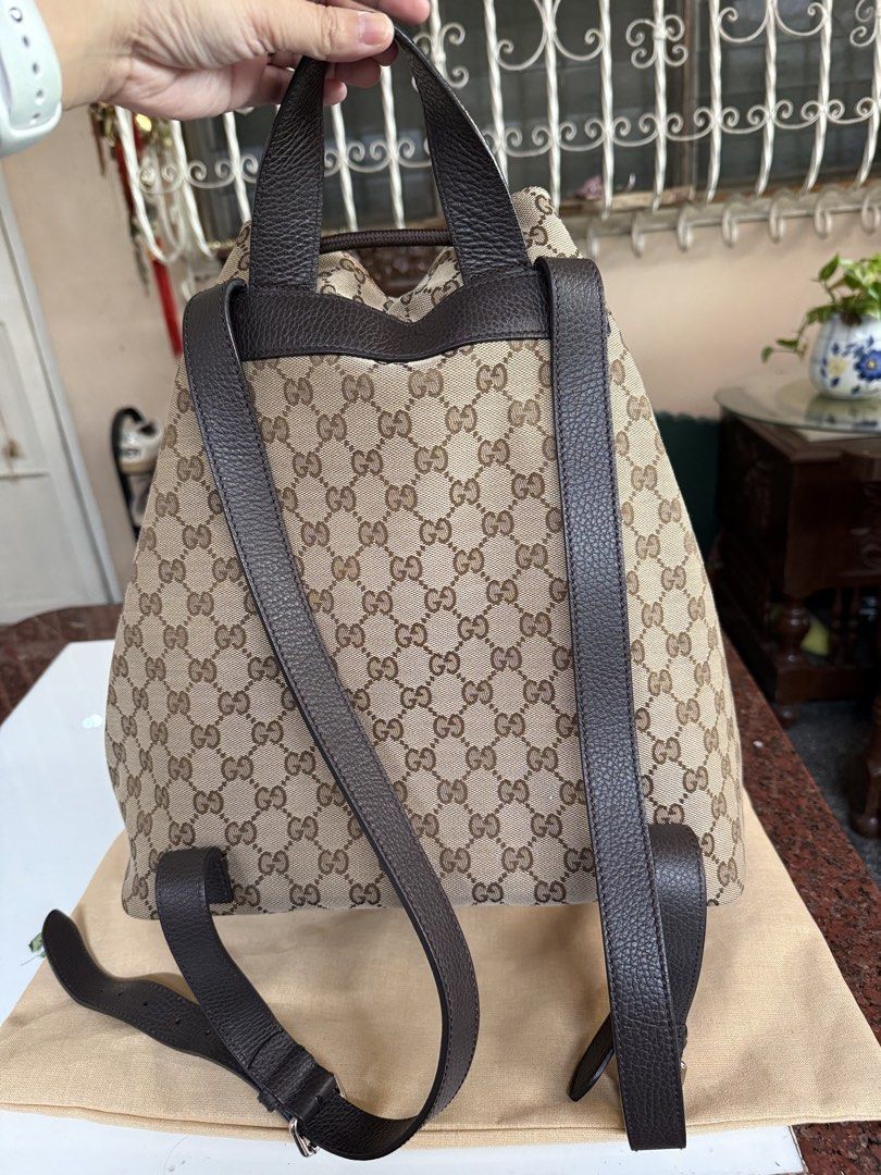 Gucci GG Canvas Drawstring Backpack (Category: Luxury Bags & Wallets) located in Pasig City. Submitted by leldebeer (Listing ID 1437938906, Image 2). Description: - Authentic Gucci backpack - Iconic GG canvas pattern - Drawstring closure - Side zipper for easy access - Adjustable straps - Top handle - Made in Italy - Includes Legitgrails Authentication - Includes Generic dustbag.