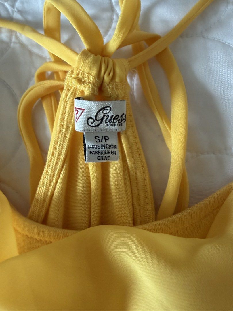 Guess Yellow Cowl Neck Tank Top (Category: Sleeveless) located in Angeles City. Submitted by aicl_ (Listing ID 1437969449, Image 2). Description: - Bright yellow Guess tank top - Halter neck with tie closure - Gathered waist.