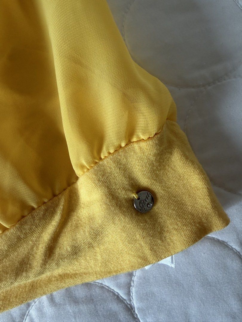 Guess Yellow Cowl Neck Tank Top (Category: Sleeveless) located in Angeles City. Submitted by aicl_ (Listing ID 1437969449, Image 3). Description: - Bright yellow Guess tank top - Halter neck with tie closure - Gathered waist.